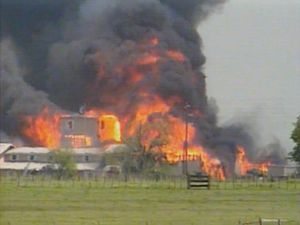 The Branch Davidian compound ablaze at Waco, Texas, on April 19, 1993; Rick Ross incited the FBI and BATF with false information about the Branch Davidians, contributing to the fatal outcome that claimed some 80 lives.